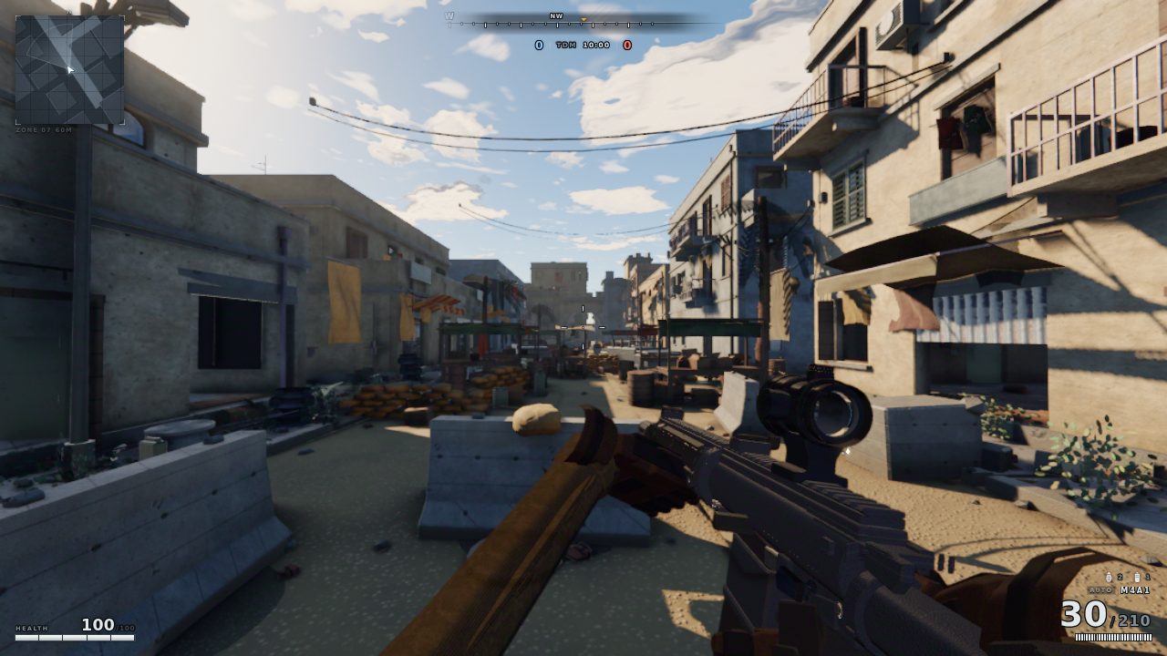 A market street with balconies, awnings, hanging laundry and power lines, seen down the barrel of a rifle